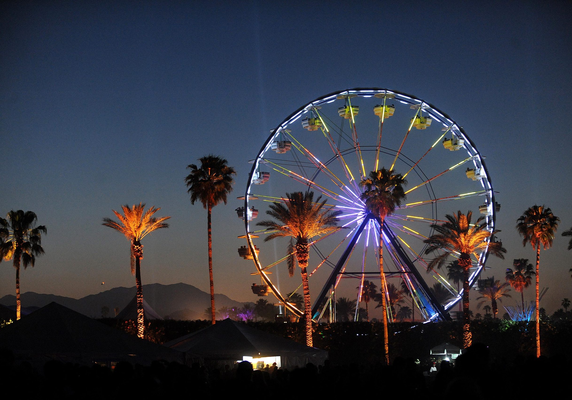 CDMW9B Apr 15, 2011 - Indio, California; USA - General Atmosphere with ferris wheel at the 2011 Coachella Music &amp; Arts Festival that is taking place at the Empire Polo Field.  The three day festival will attract thousands of fans to see a variety of artist on six different stages.  Copyright 2011 Jason Moo